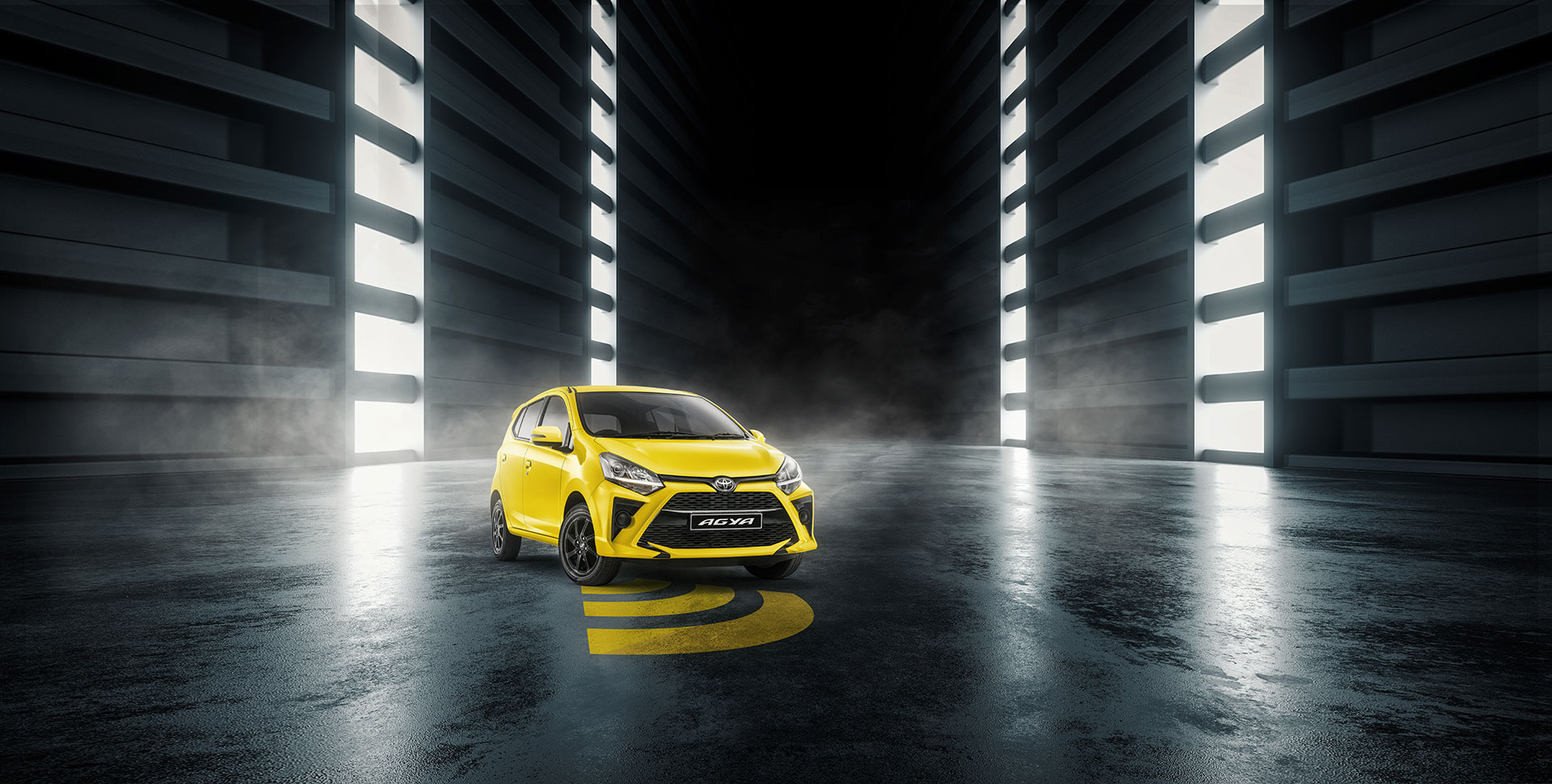 front view of yellow Toyota Agya