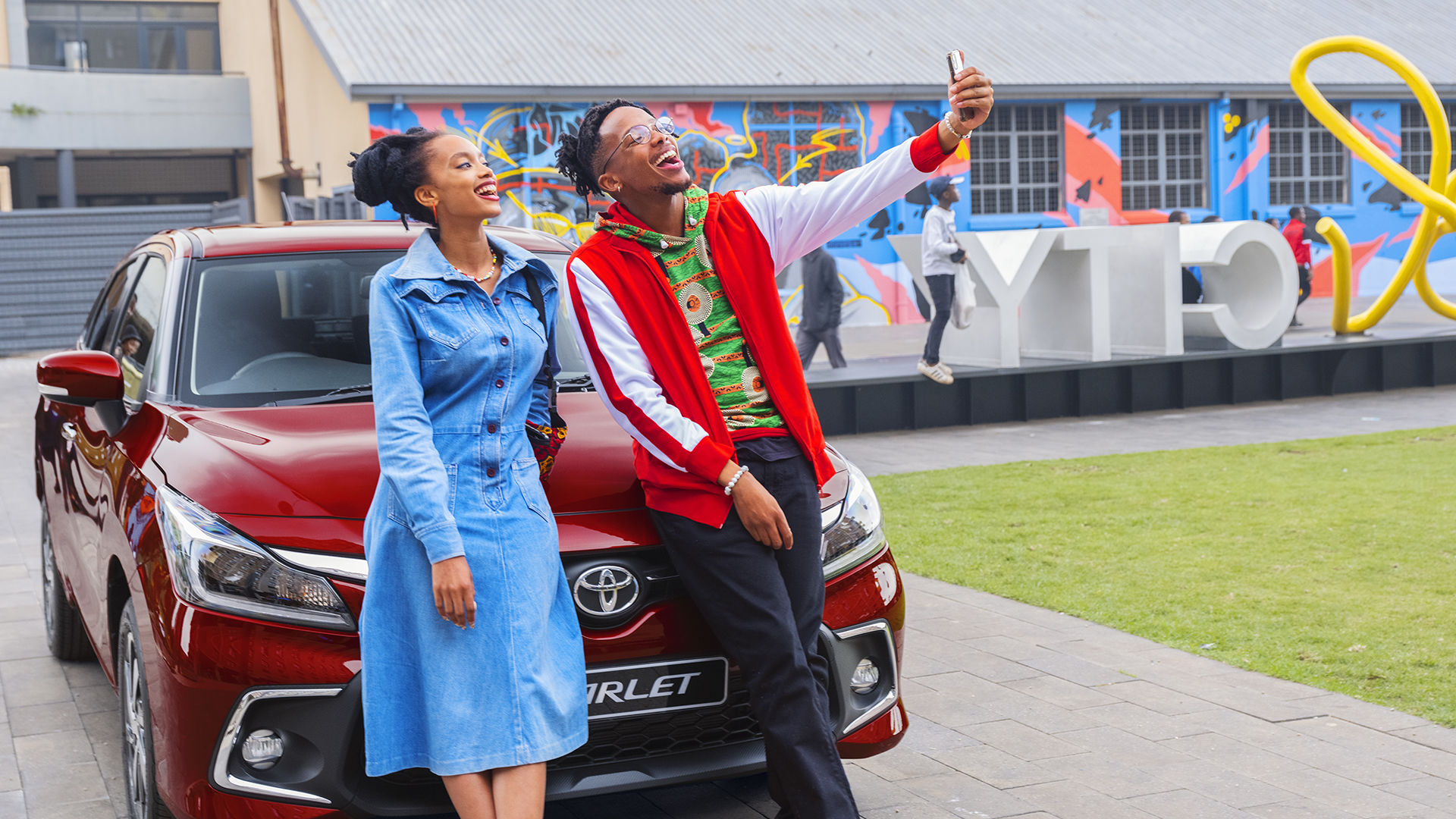 Two happy Toyota car owners taking a selfie