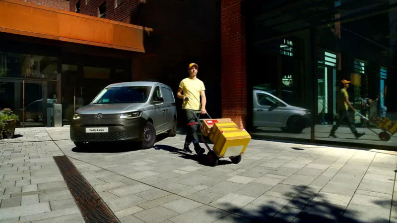 VW Caddy Cargo captured outside a building
