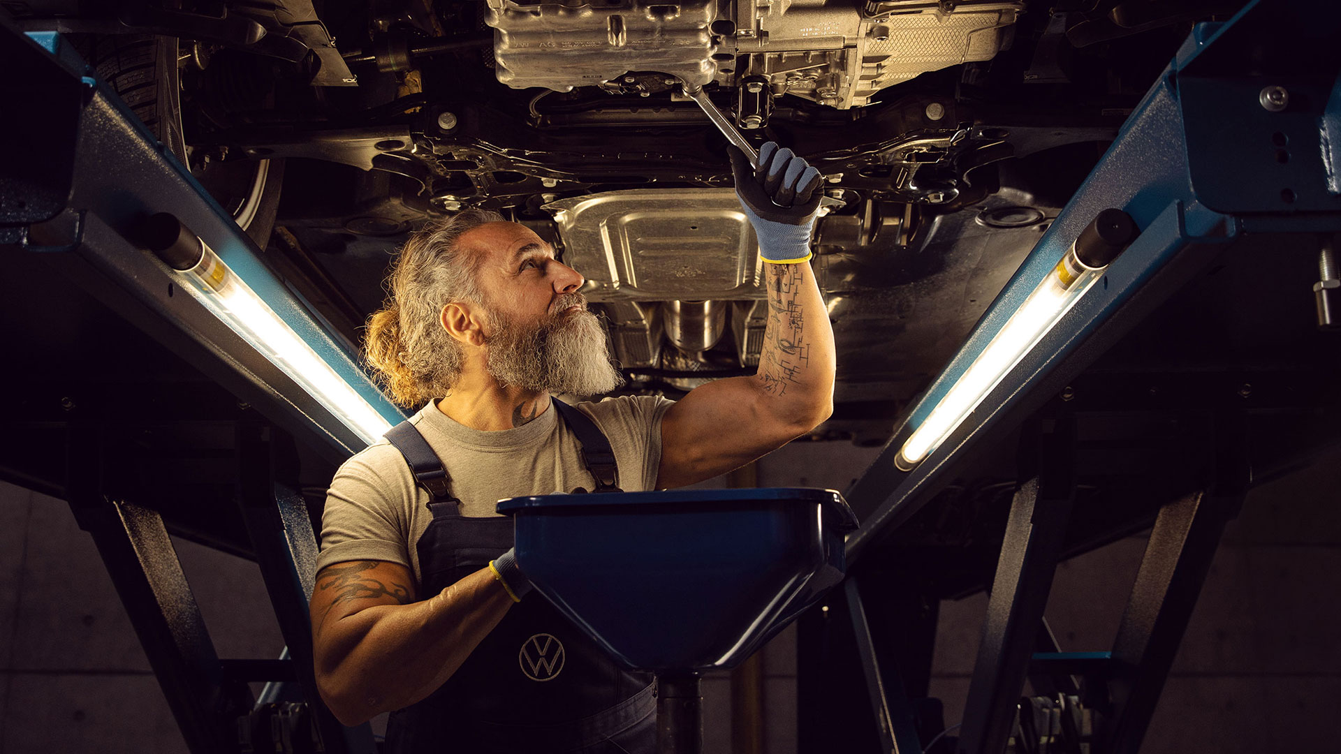 VW technician working on a vehicle